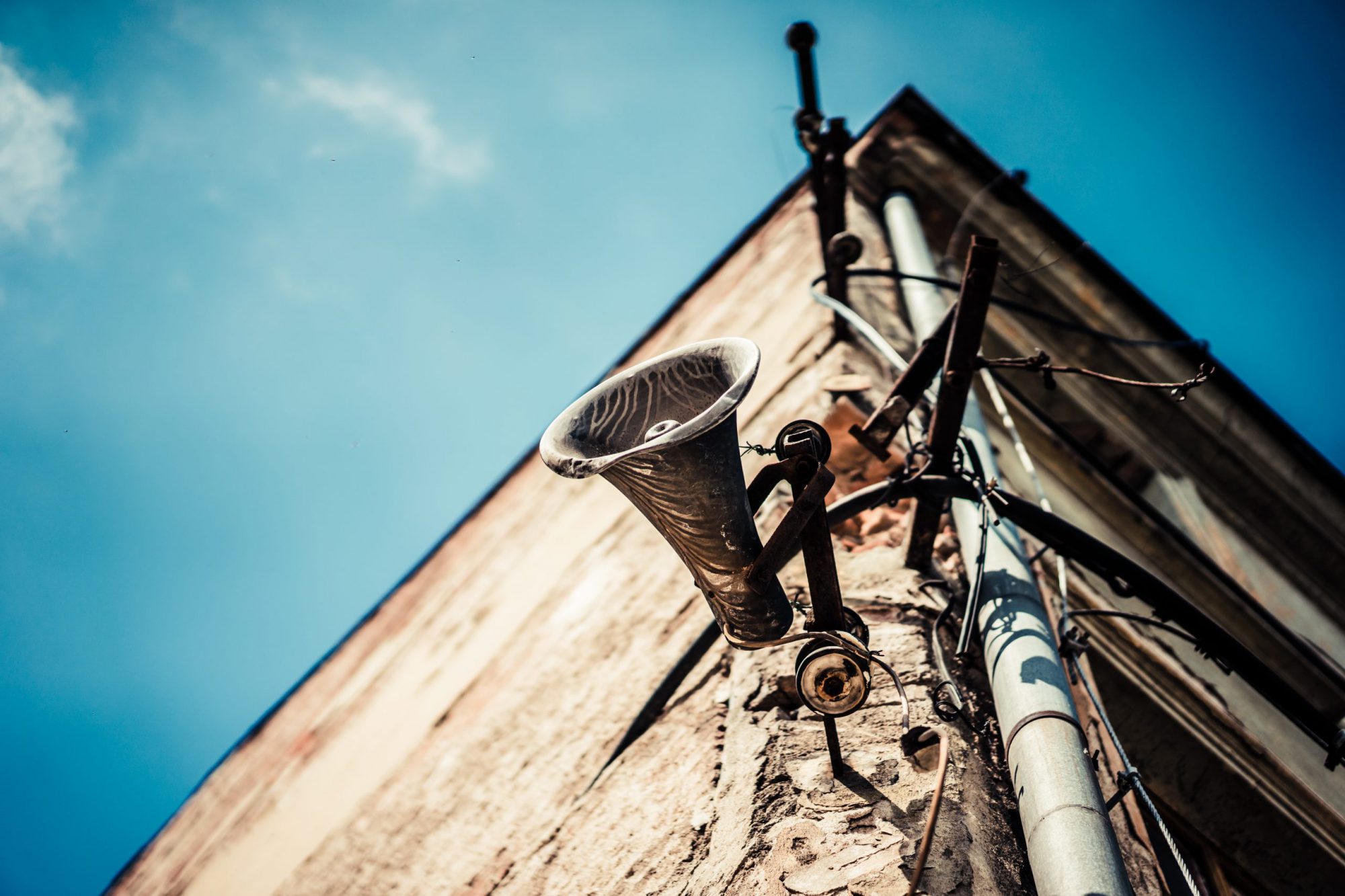 old-loudspeaker-megaphone-on-abandoned-house-picjumbo-com